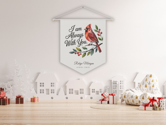 Decorative wall hanging with a cardinal and text on a white wall with Christmas decor.