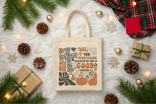 Tote bag with autumn design and text on a festive background with pinecones, lights, and gift boxes.
