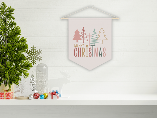 Decorative Christmas banner with trees and 'Merry Christmas' text on a white wall.