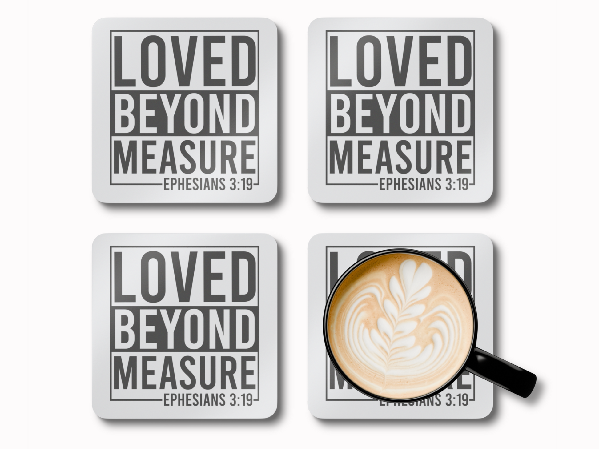 Set of four coasters with “Loved Beyond Measure – Ephesians 3:19” text, one holding a latte in a black cup.