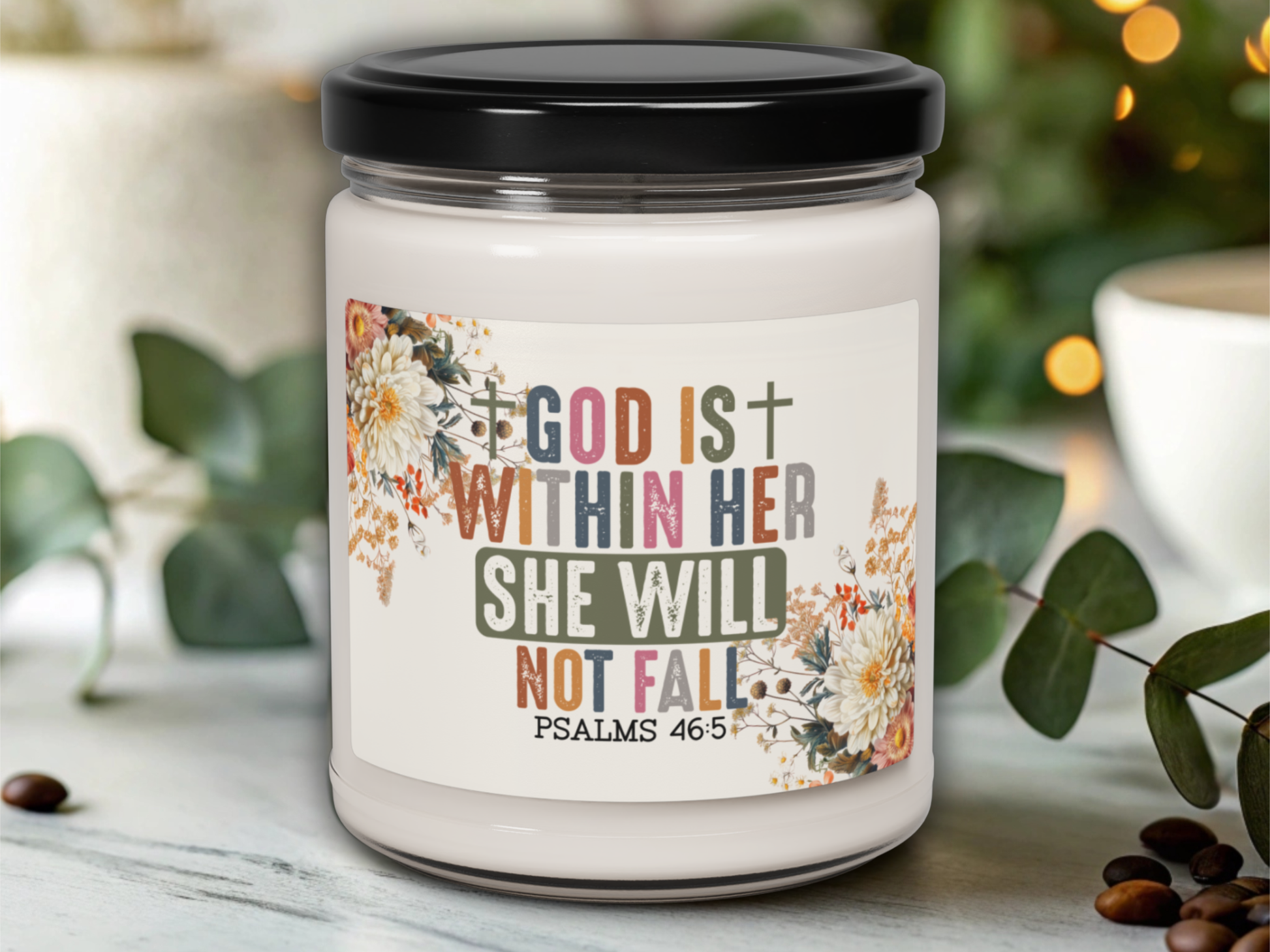 Candle jar with motivational quote on a blurred background
