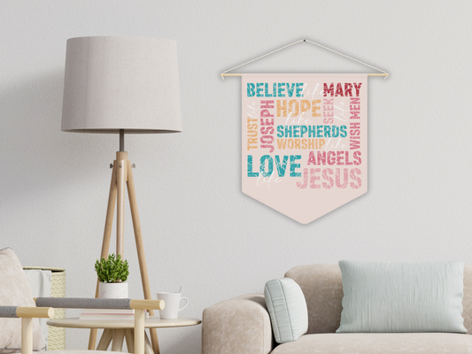 Decorative banner with colorful text hanging on a wall in a living room.