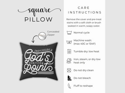 Black pillow with 'Impossible is God's Starting Point' text and care instructions on a white background