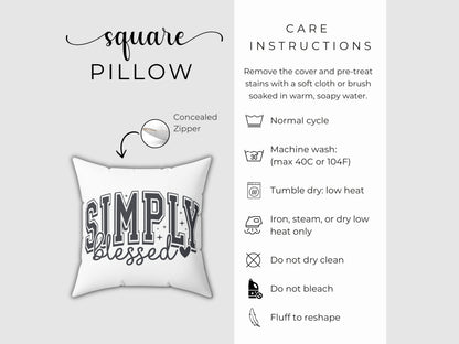 White pillow with 'Simply Blessed' text and care instructions on a gray background