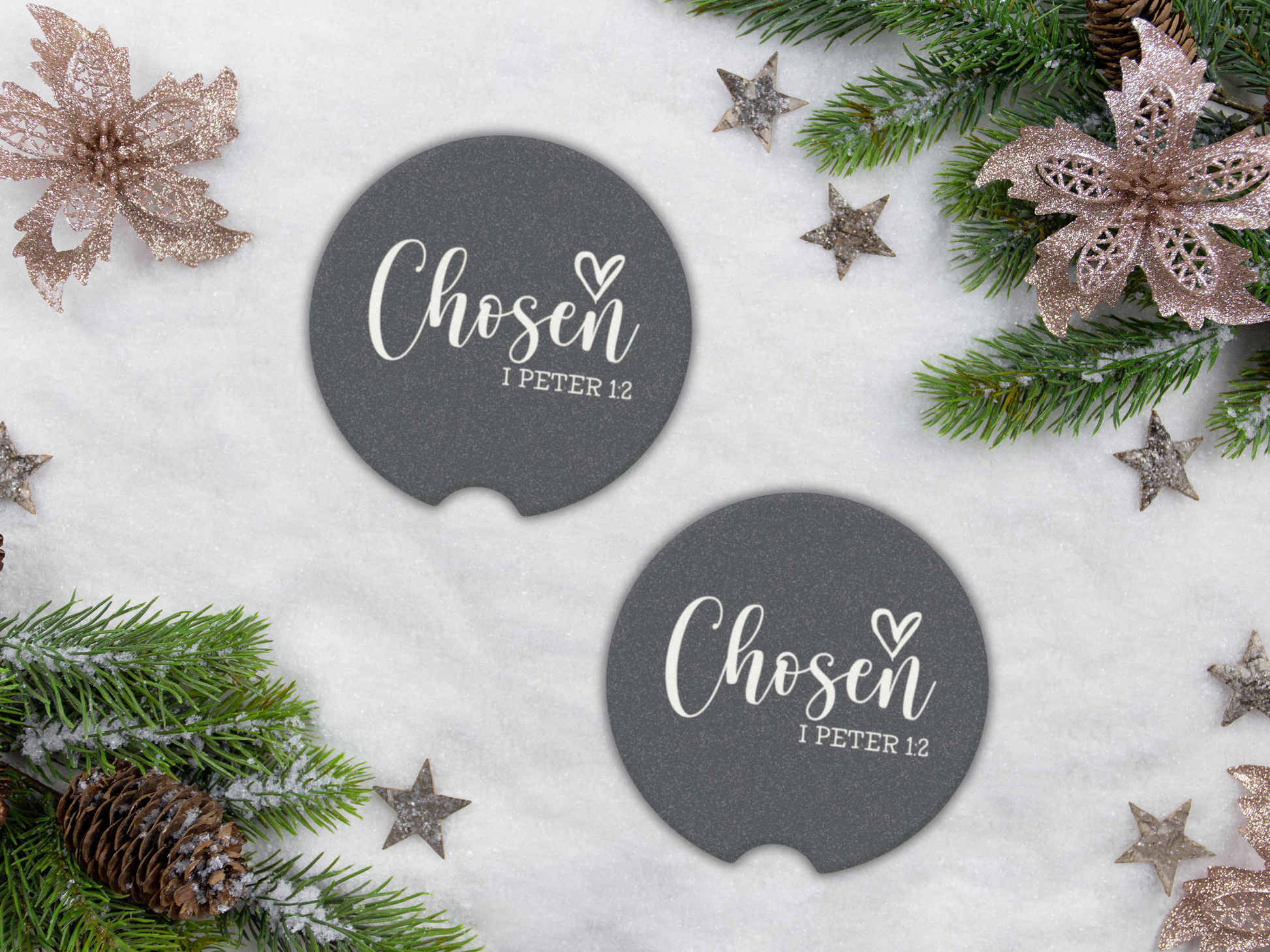 Two navy car coasters with 'Chosen I Peter 1:2' text on a snowy background with Christmas decorations.