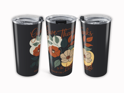 Three black tumblers with floral designs and text on a white background