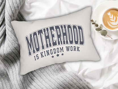 Scripture pillow on white bedding with gray knit blanket and latte in saucer with eucalyptus sprig.