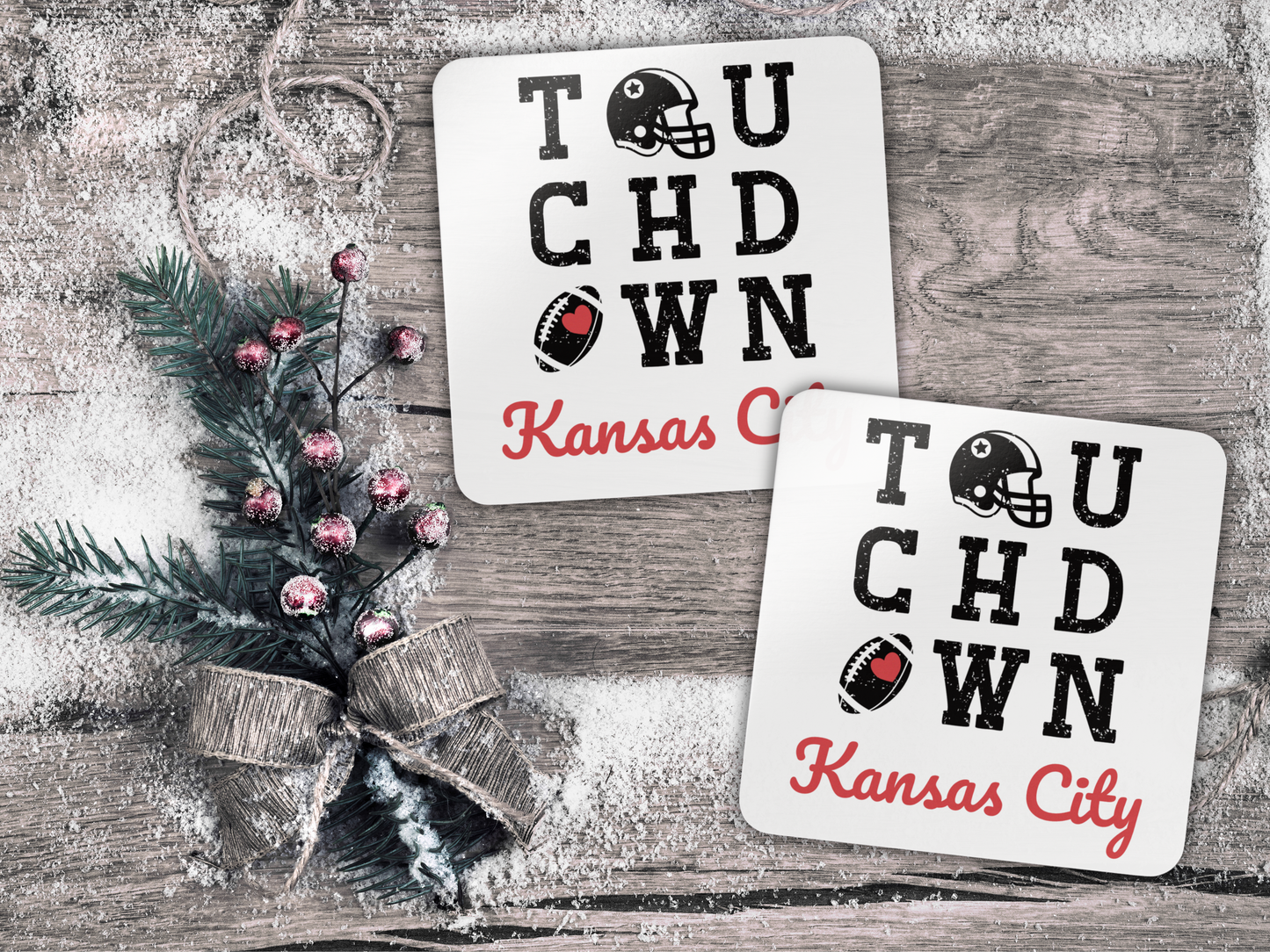 Two 'Touchdown Kansas City' coasters on a wooden surface with decorative elements.