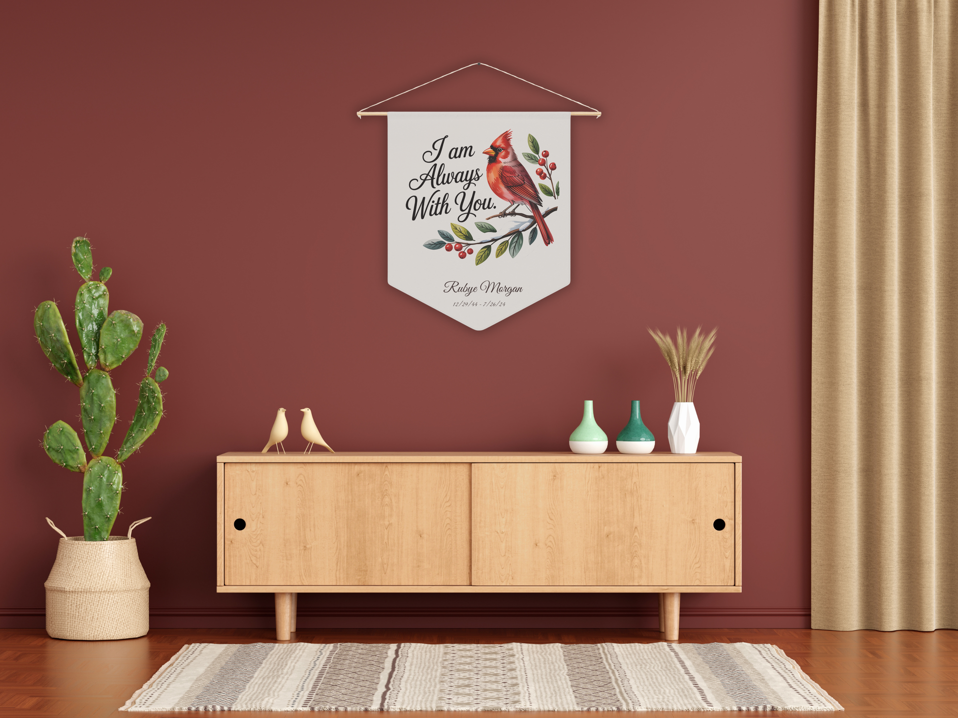 Decorative wall pennant with a cardinal design in a room with a wooden cabinet, plants, and a rug.