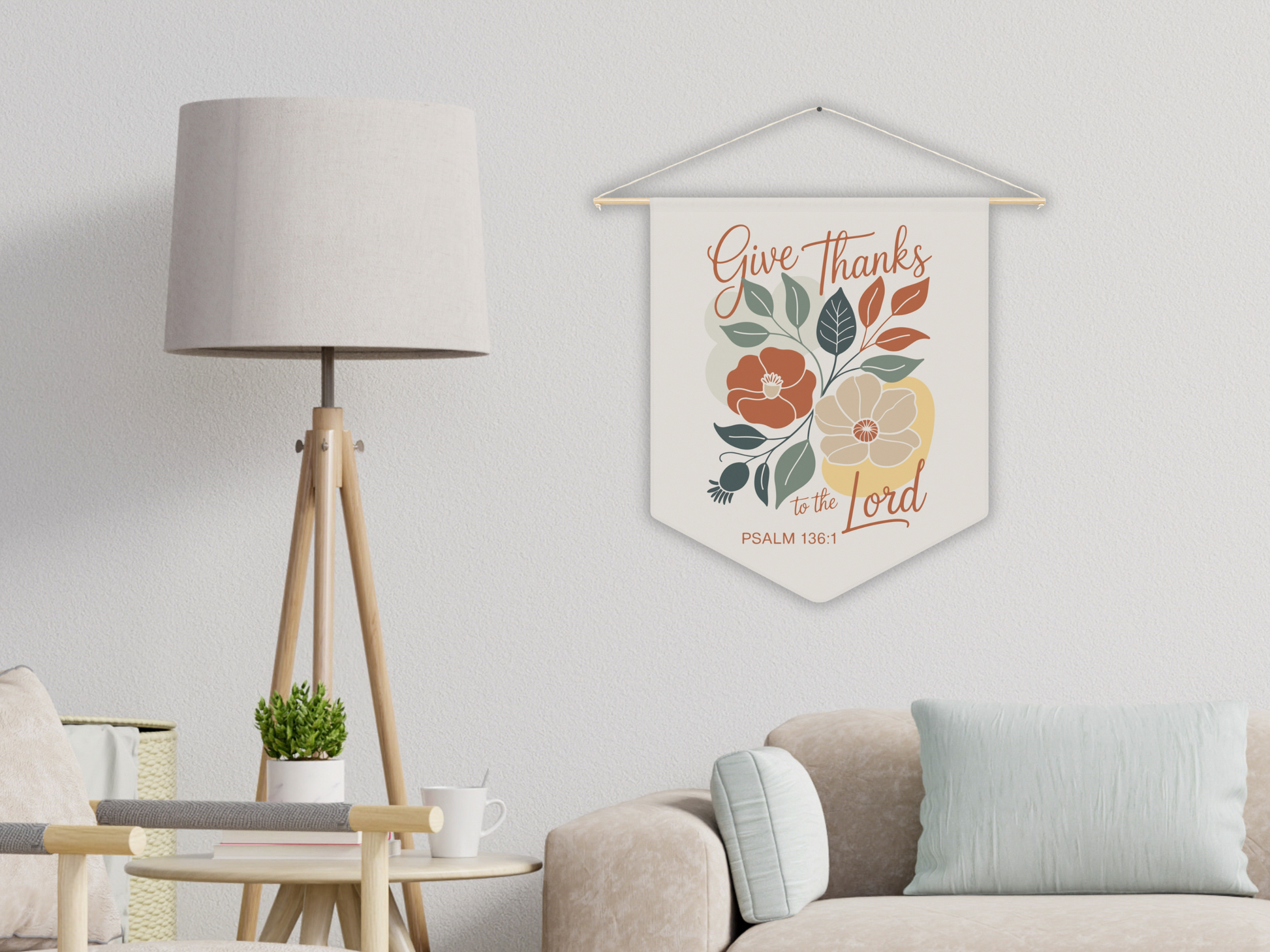 Decorative wall hanging with floral design and text in a living room setting.
