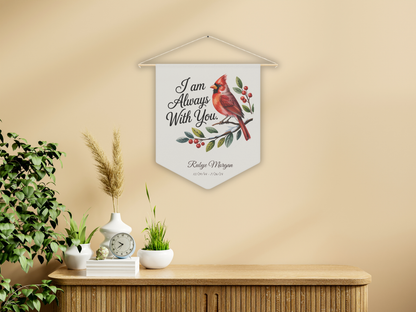 Decorative wall hanging with a cardinal bird design and text on a beige wall.