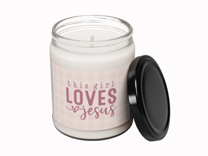 Candle in a jar with 'this girl loves Jesus' text on a white background