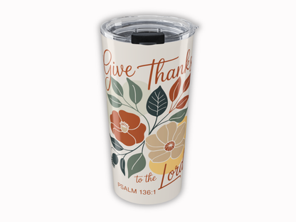 Tumbler with floral design and text on a beige background