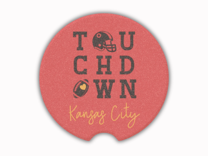 Red car coaster with 'Touchdown Kansas City' text and football graphics on a white background