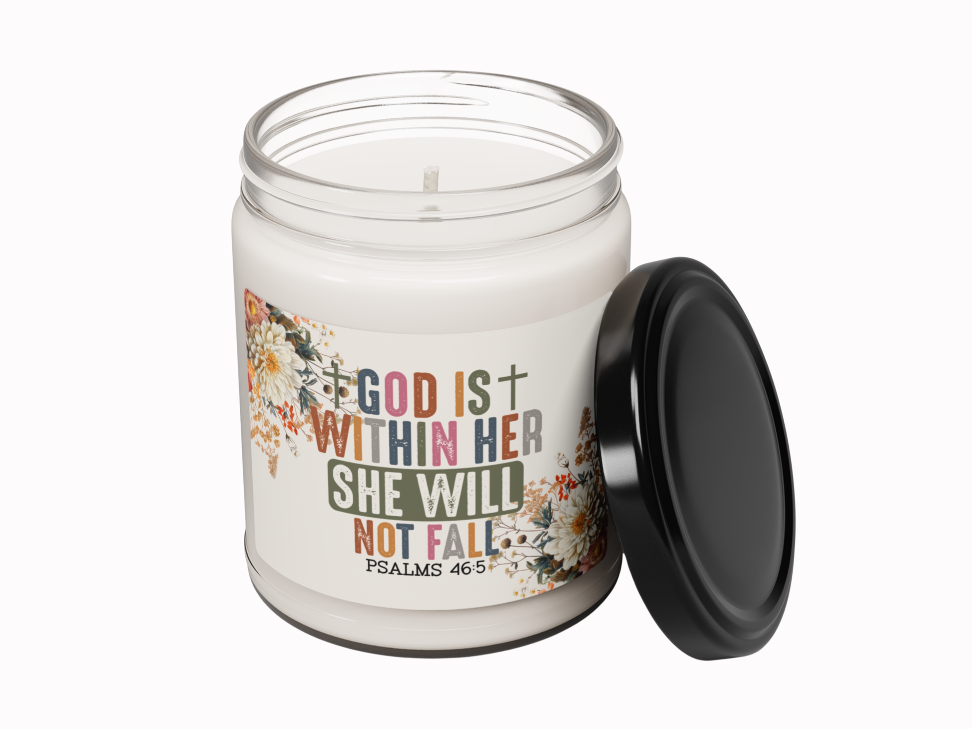 Candle jar with motivational quote and floral design on a white background