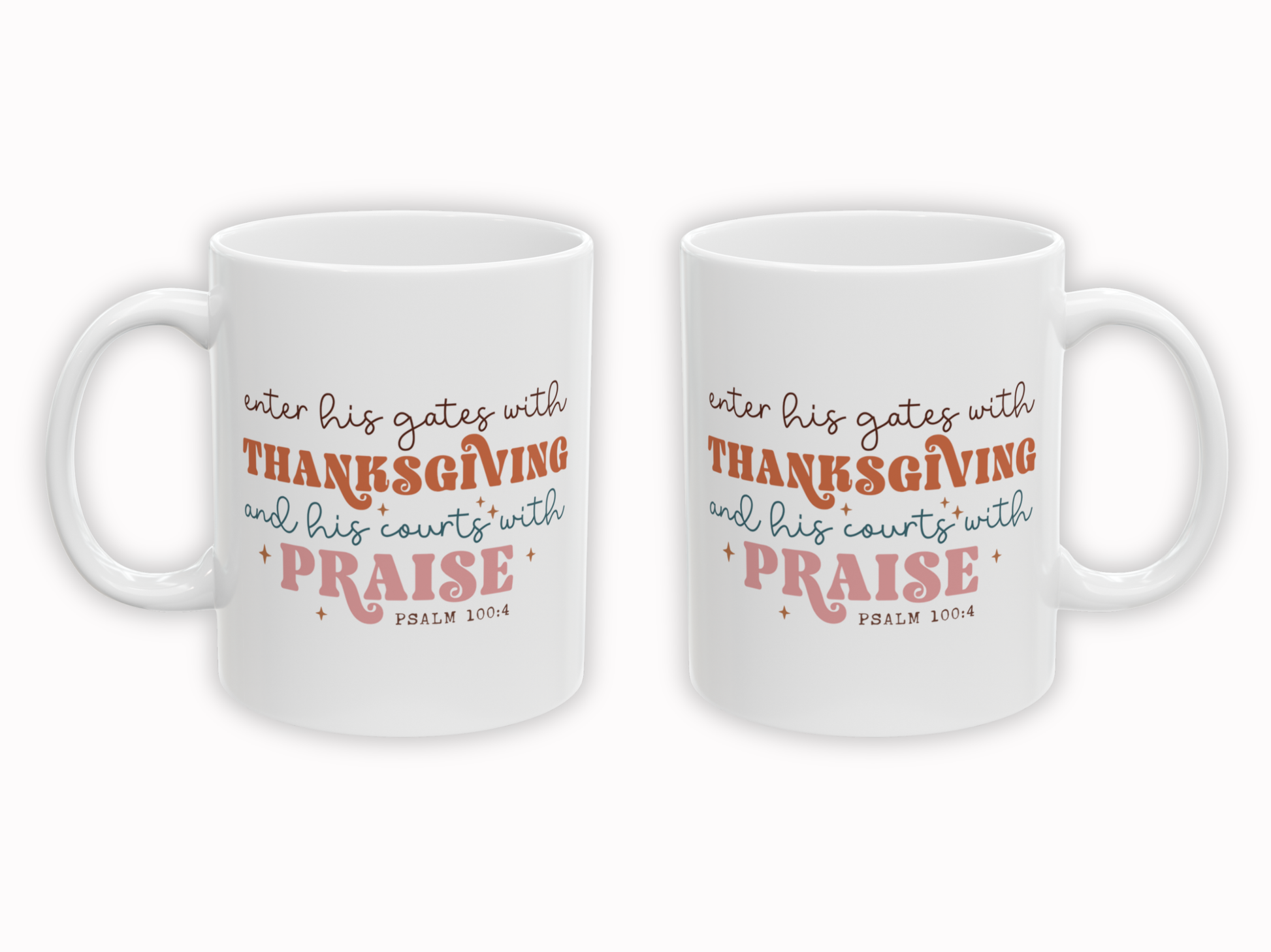 Two white mugs with orange and pink text on a white background