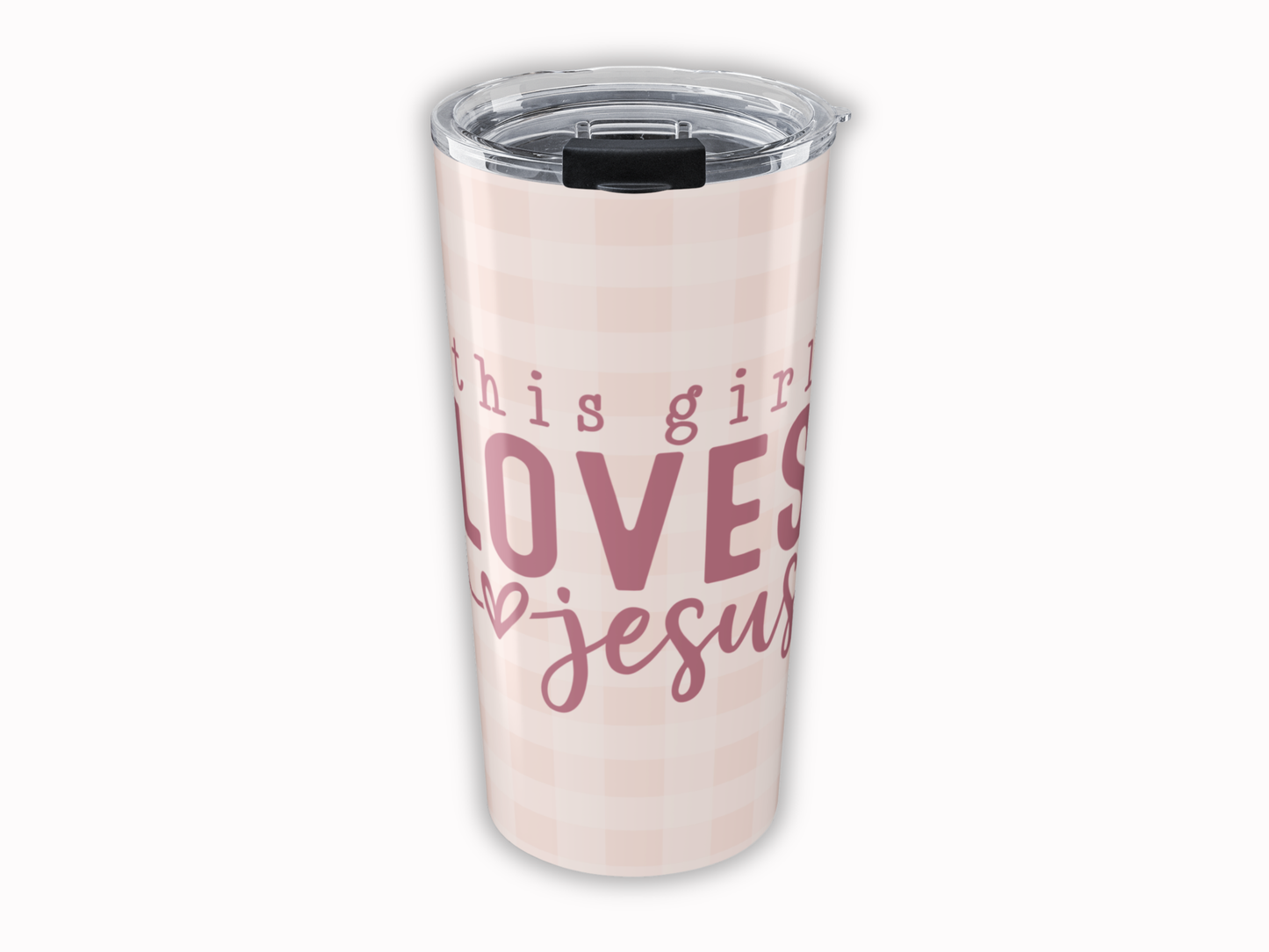Tumbler with 'This girl loves Jesus' text on a light pink background