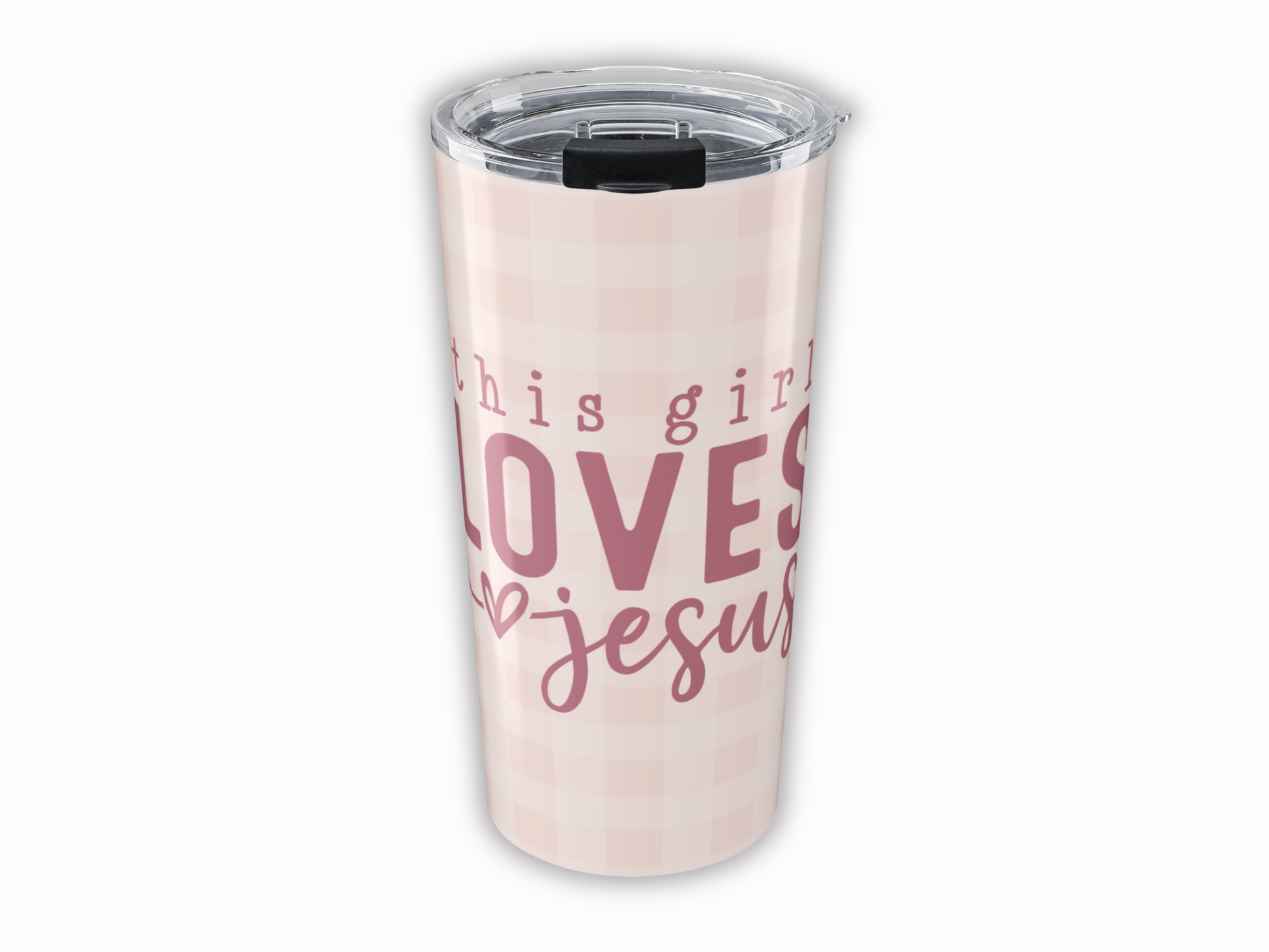 Tumbler with 'This girl loves Jesus' text on a light pink background