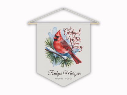 Decorative pennant with a red cardinal bird and text on a white background