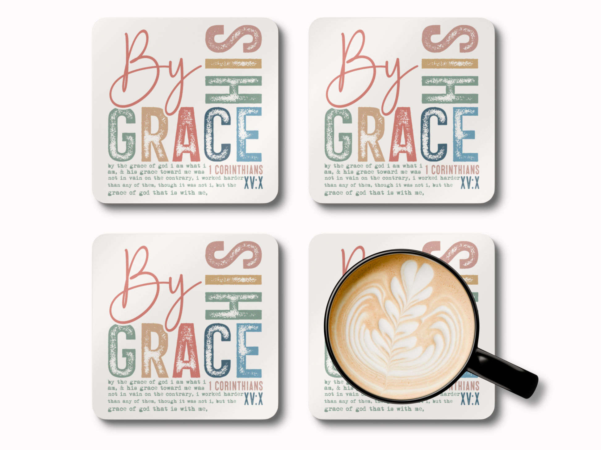 Set of four “By His Grace” scripture coasters with latte art coffee cup, featuring 1 Corinthians verse.