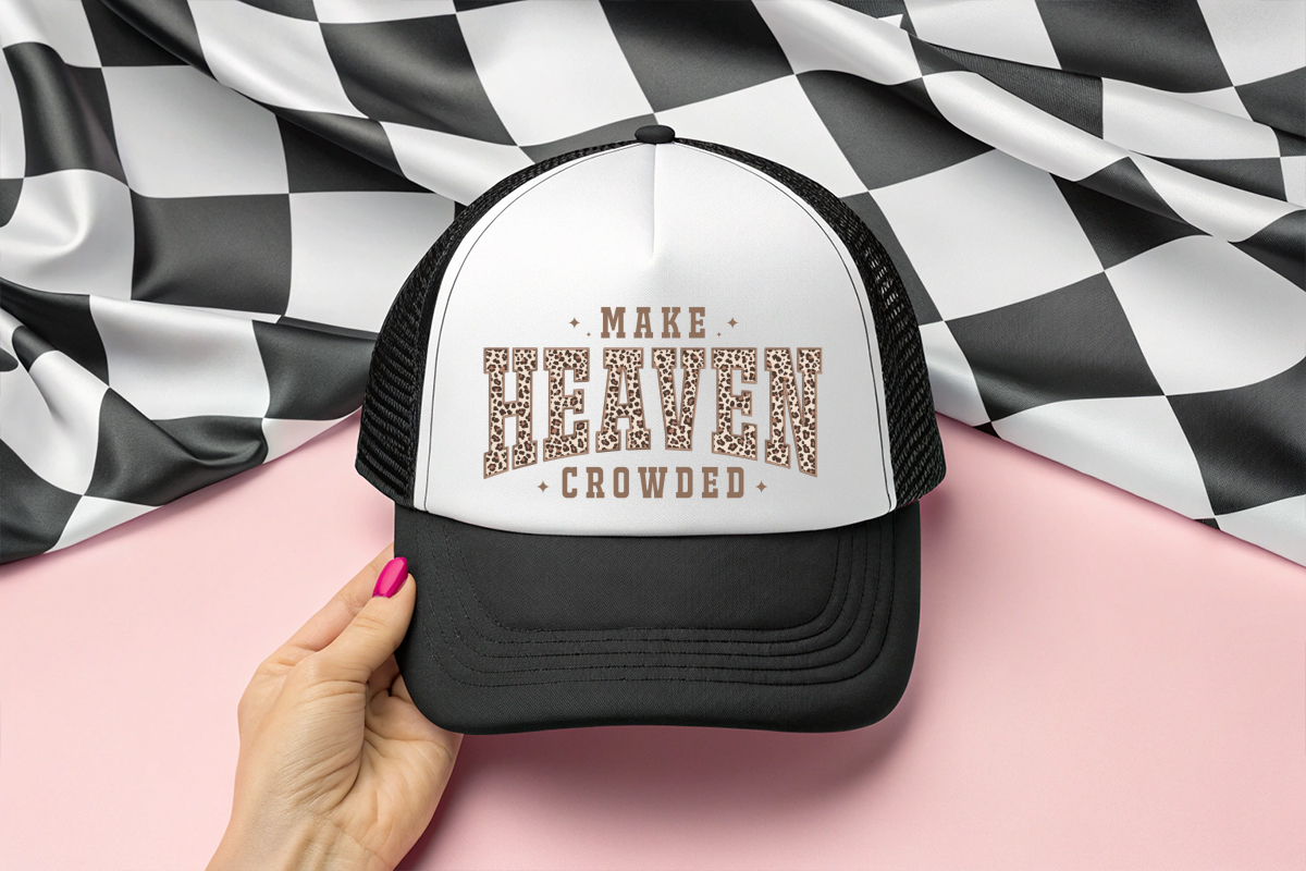 Trucker hat with 'Make Heaven Crowded' text on a checkered background
