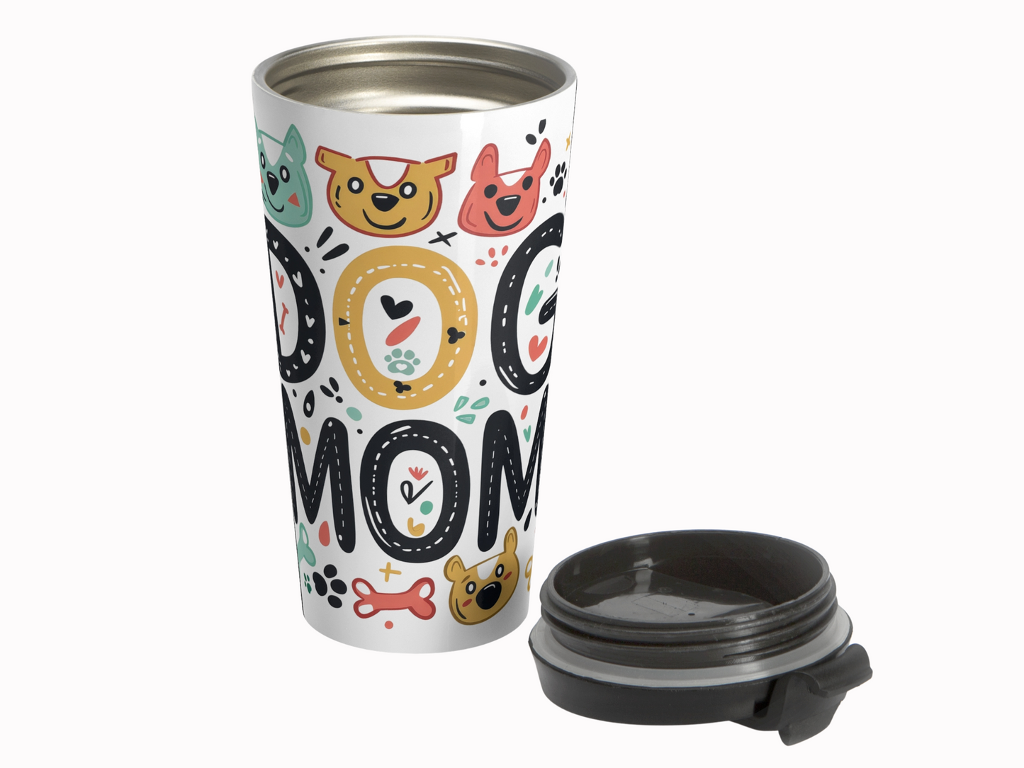 Colorful travel mug with "Dog Mom" text, decorated with cheerful cartoon dog faces, bones, and paw prints. Lid shown separately. Fun, playful design.