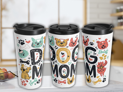 Three white travel mugs with black lids feature "DOG MOM" in bold, colorful letters, adorned with cute, playful dog illustrations and paw prints.