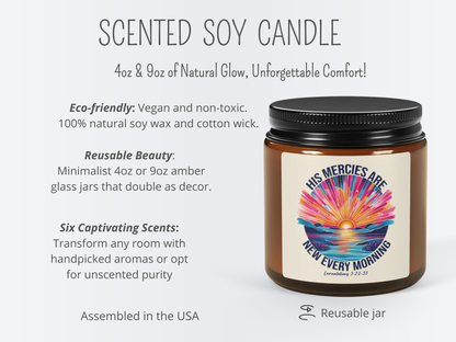 A promotional image for a scented soy candle. The jar is amber with a black lid and has a label showing a vibrant sunrise over water with text, “His mercies are new every morning.” Text highlights the eco-friendly, vegan, and non-toxic soy wax with a cotton wick, available in 4oz and 9oz reusable jars. Assembled in the USA; offers six scents or unscented options.