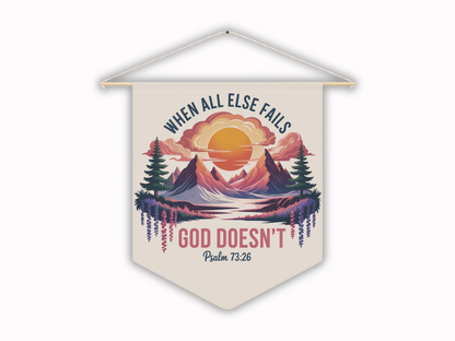 Wall decor with a sunset over mountains, pine trees, and flowers. Text reads, "When all else fails, God doesn't" with "Psalm 73:26" below. Serene and uplifting.