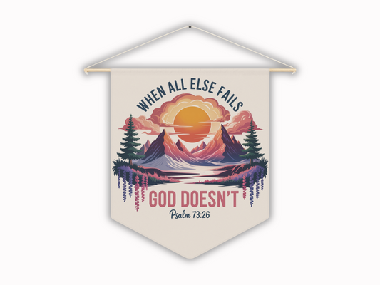 Wall decor with a sunset over mountains, pine trees, and flowers. Text reads, "When all else fails, God doesn't" with "Psalm 73:26" below. Serene and uplifting.