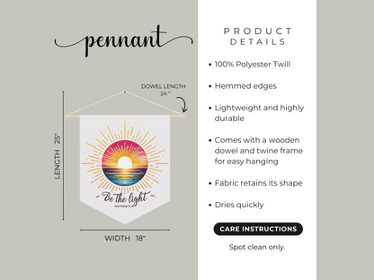 A pennant with a colorful sunset and the text "Be the light, Matthew 5:14." Dimensions: 25"x18", polyester twill, includes dowel. Spot clean only.