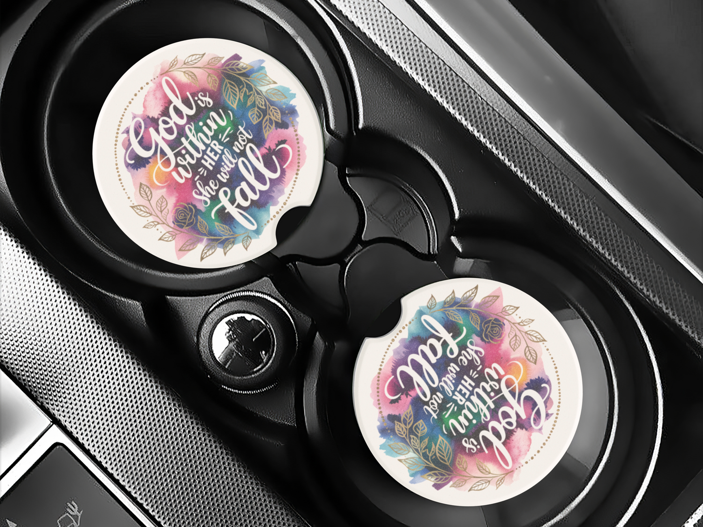 Car cup holders with colorful coasters featuring the quote "God is within her, she will not fall." The design includes floral patterns with a calm, uplifting tone.