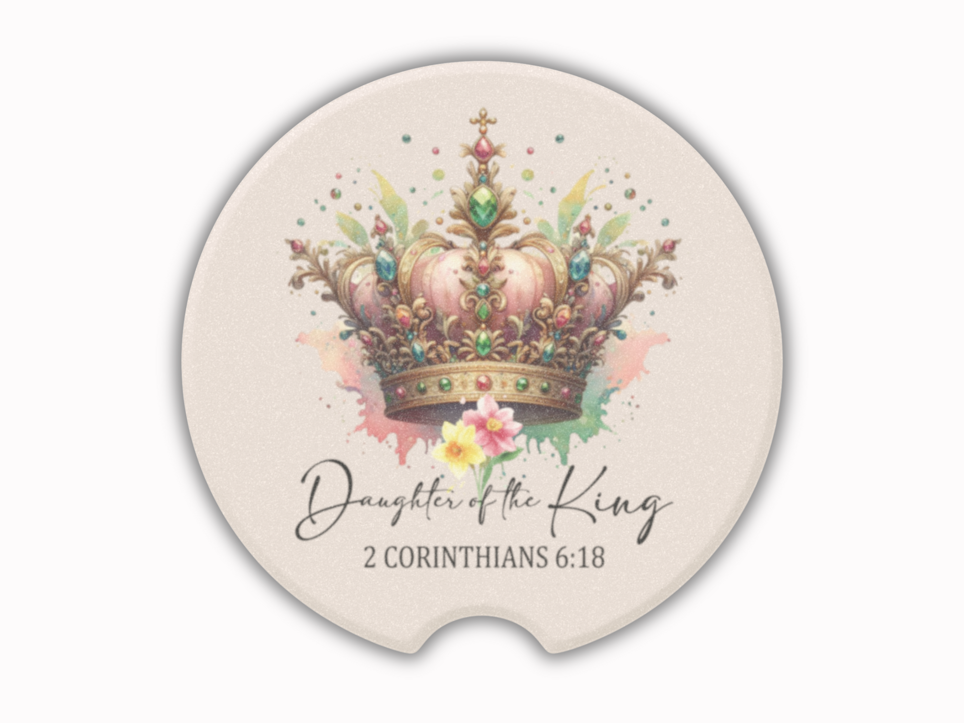 A round, beige coaster features a detailed crown adorned with colorful jewels. Beneath, elegant text reads “Daughter of the King, 2 Corinthians 6:18.” Multicolored paint splashes add vibrancy.