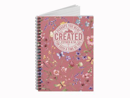 Floral religious journal with the quote "Perhaps you were created for such a time as this. Esther 4:14." The background is pink with colorful flowers.