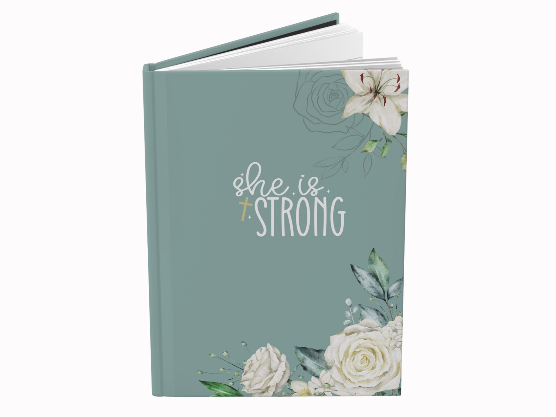 A mint green journal cover features the text "She is Strong" in elegant white script. Decorated with delicate illustrations of white roses and lilies.
