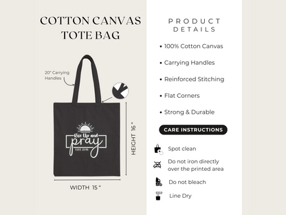 Black cotton canvas tote bag with 20-inch handles and a "Rise Up and Pray" design. Features: strong, durable, reinforced stitching. Care: spot clean, line dry.