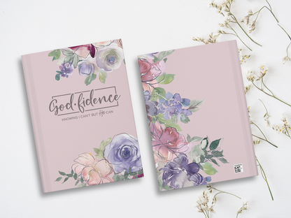 Two soft purple books with watercolor floral designs are on a white background. The front one reads "Godfidence: Knowing I can't but He can" in elegant script.