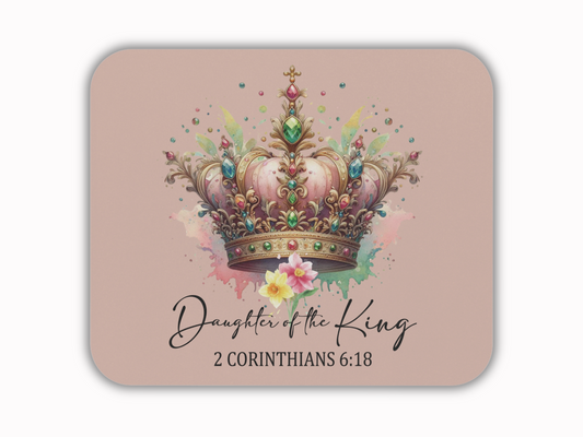 Mouse pad with a luxurious crown adorned with jewels on a pink background with floral accents. Text reads "Daughter of the King, 2 Corinthians 6:18." Elegant and regal.