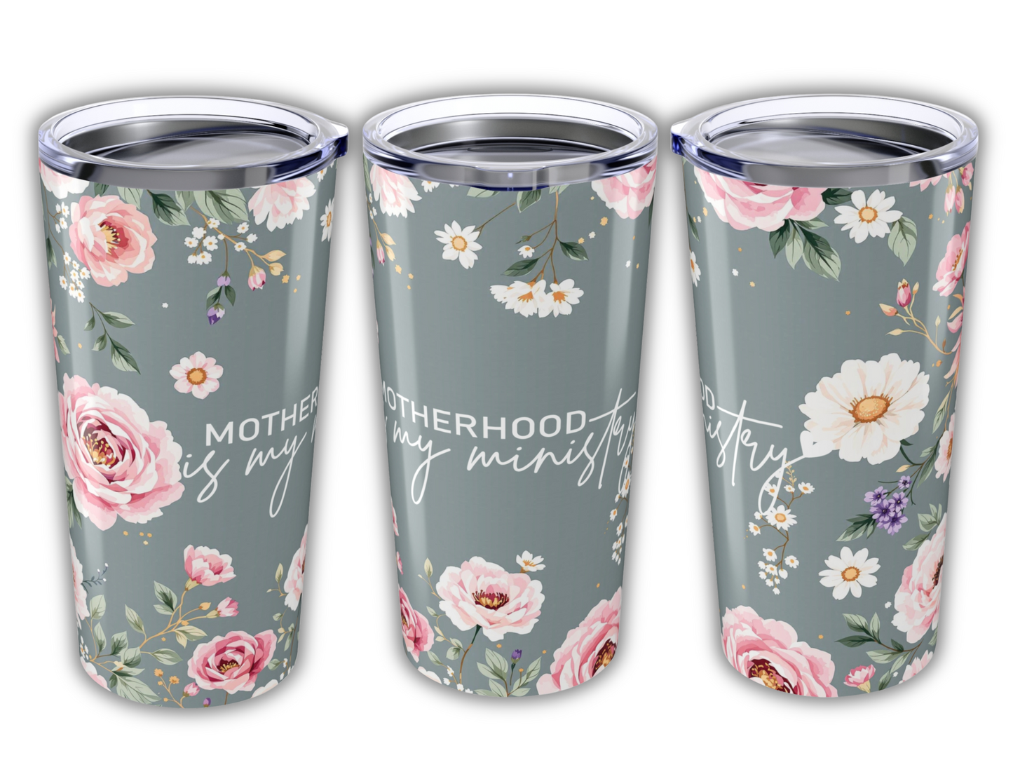 Floral tumbler with pastel pink and white flowers on a gray background. Text reads "Motherhood is my ministry" in elegant script.
