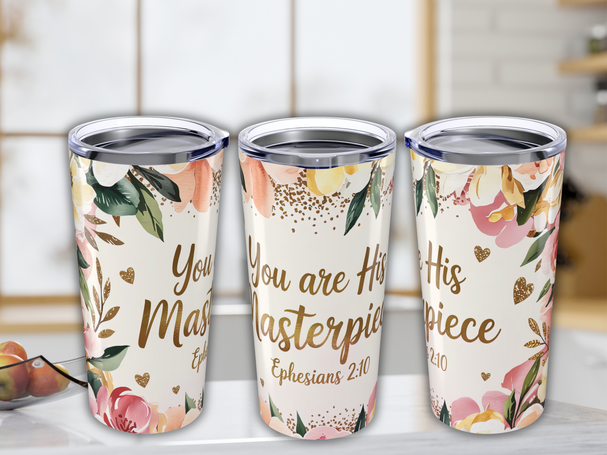 Three floral tumblers feature uplifting messages like "You are His Masterpiece" in elegant script, set against a soft, pastel background; a serene, inspiring tone.