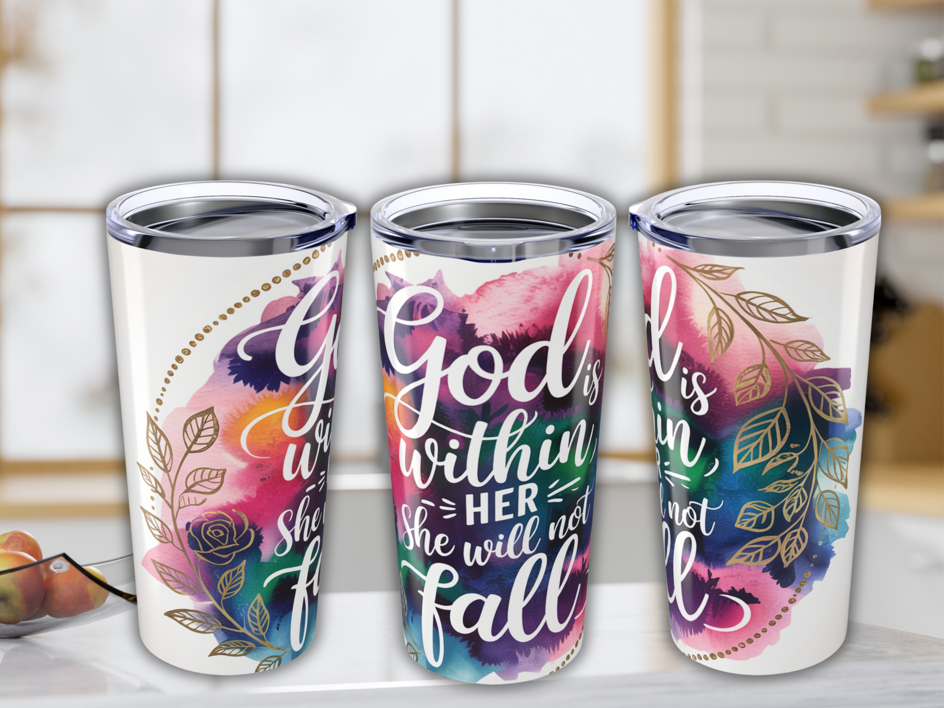 Three tumblers with colorful watercolor backgrounds featuring gold leaf designs and the inspiring quote "God is within her, she will not fall."