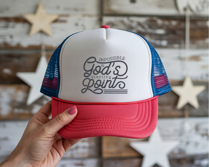 Trucker hat with motivational quote held by a hand against a wooden wall background
