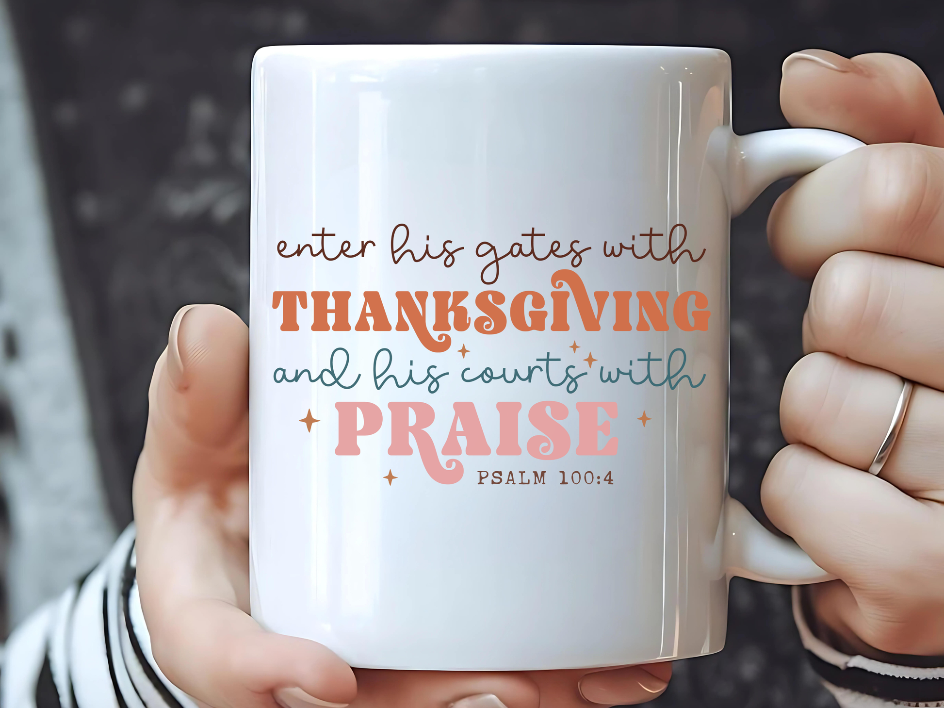 White mug with inspirational quote held by a person