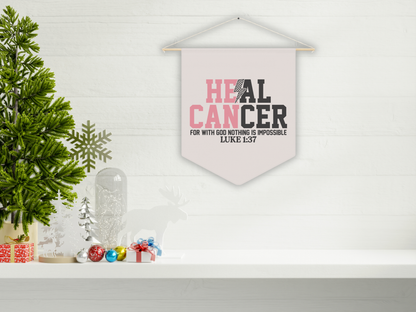 Decorative banner with 'HEAL CANCER' text on a wall with Christmas decorations.