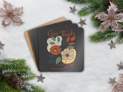 Coasters with floral design and text on a snowy background with Christmas decorations