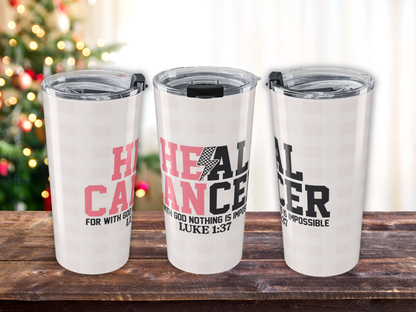 Three pink plaid  tumblers with motivational text on a wooden surface with a blurred Christmas tree background.