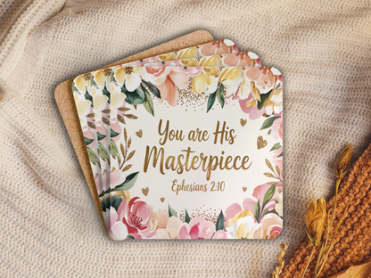 Stack of floral scripture coasters with cork backing, placed on a soft knit blanket alongside dried flowers for a cozy look.