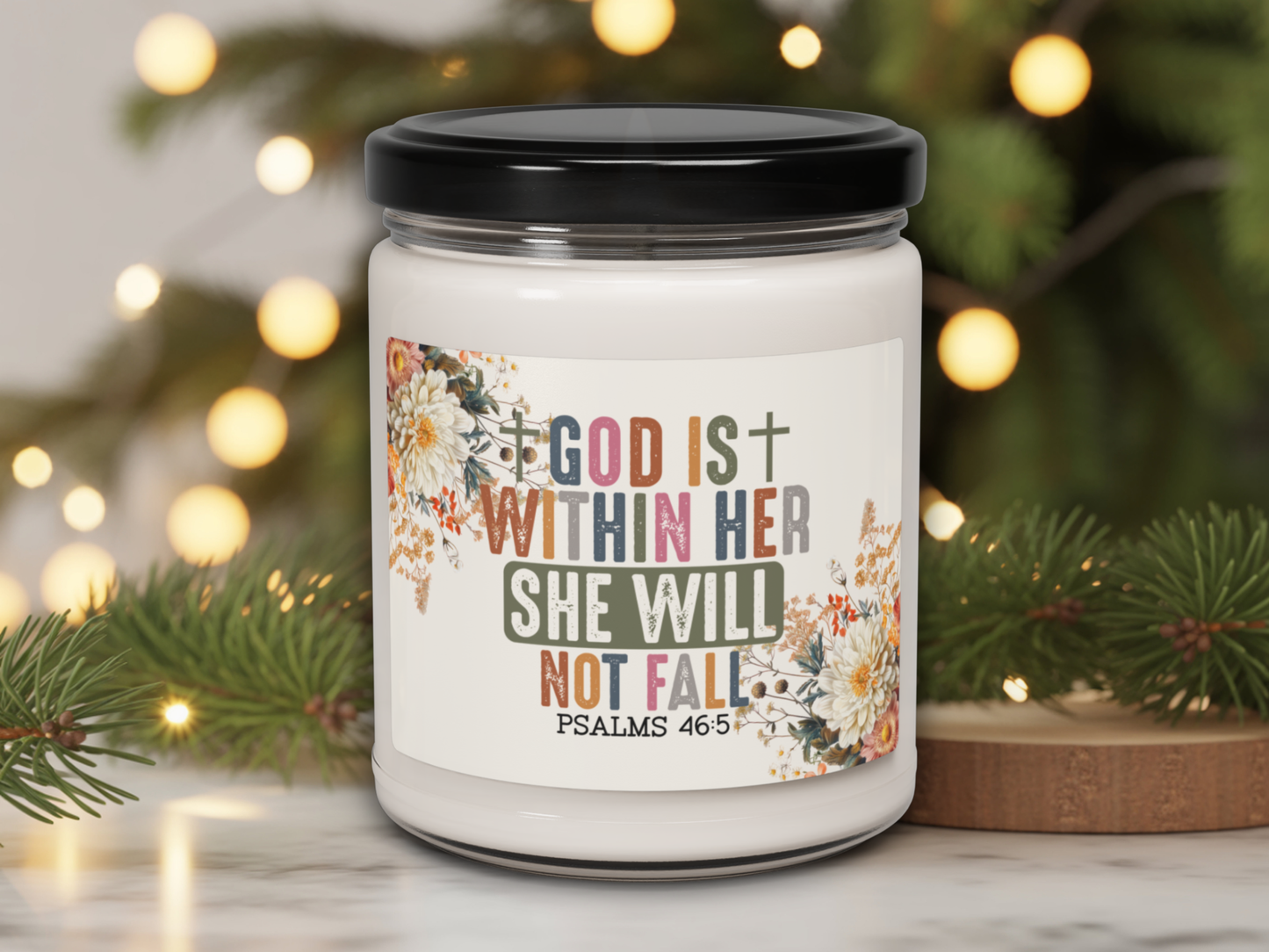 Candle jar with motivational quote against a festive background