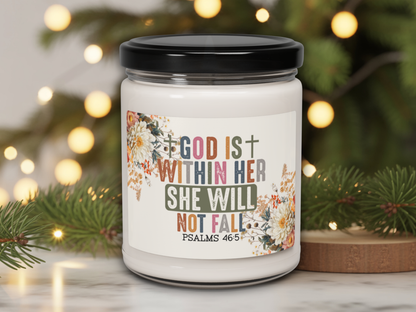 Candle jar with motivational quote against a festive background