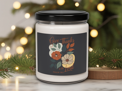 Candle jar with 'Give Thanks to the Lord' label against a festive background